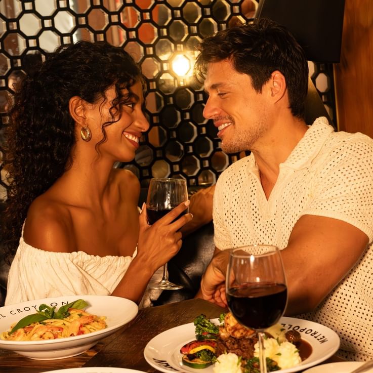A couple enjoying a meal at a restaurant.