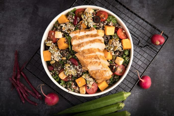Grain bowls with chicken & vegetables served at Anaheim Portofino Inn, a Disneyland area hotel with renovated family suites