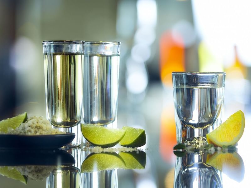 Tequila shots served with lime wedges in the Pool Bar at Live Aqua Resorts and Residence Club