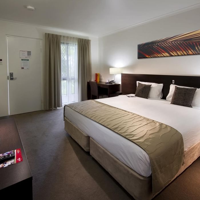 King bed, flat-screen TV, desk area, and modern decor in Superior Room at Mercure Hotel Townsville