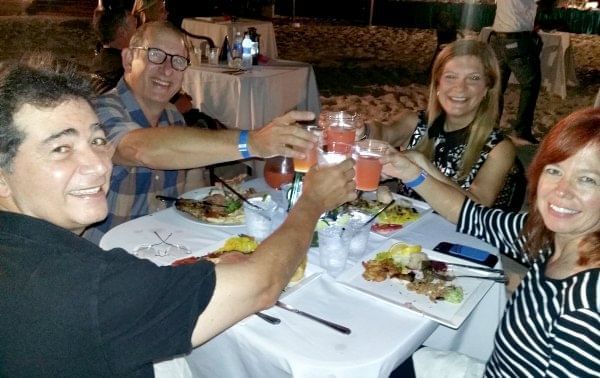 Group of people toasting at The Somerset On Grace Bay