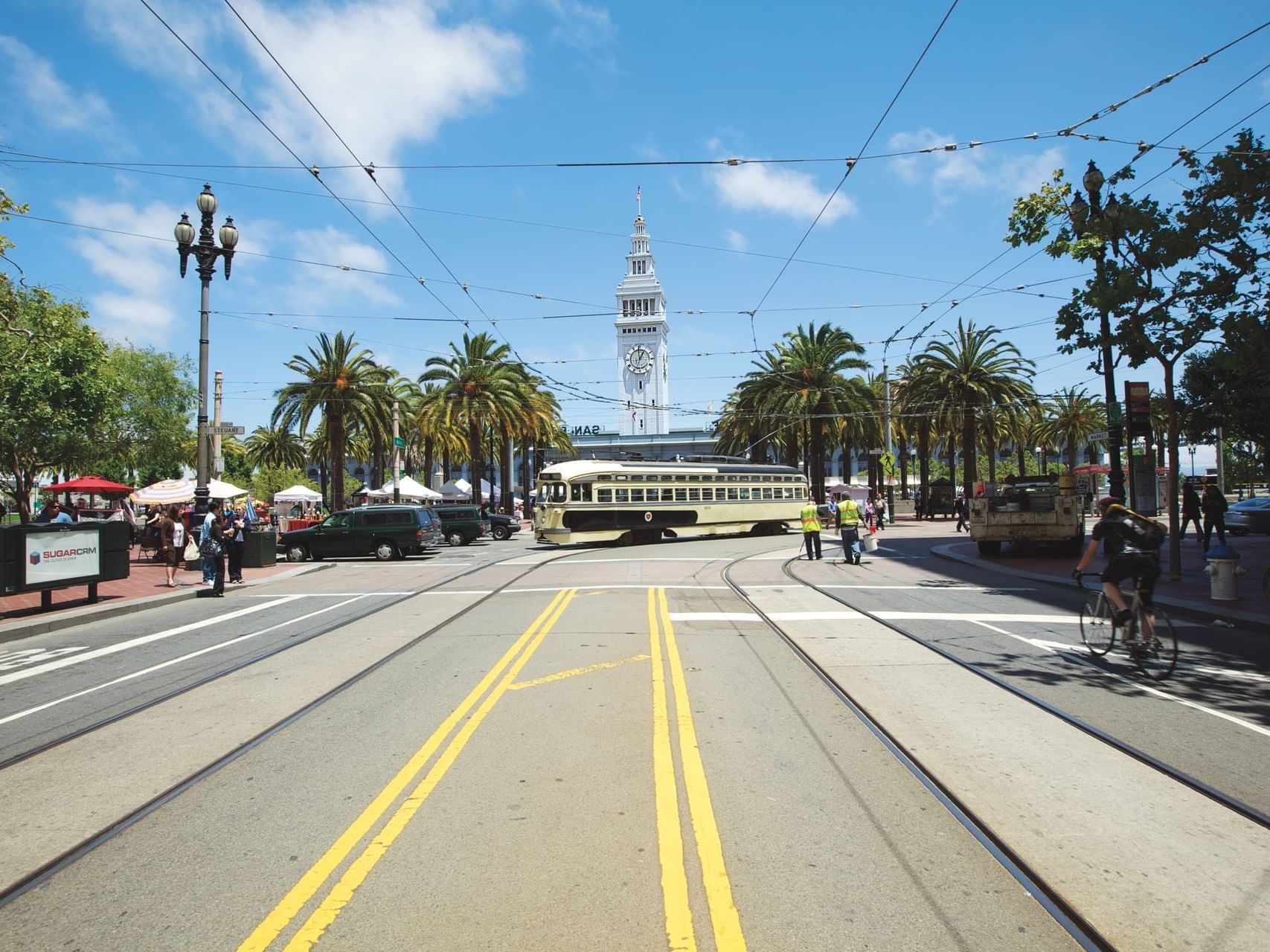 Crowded Market Street with vehicles and trees near Becks Motor Lodge