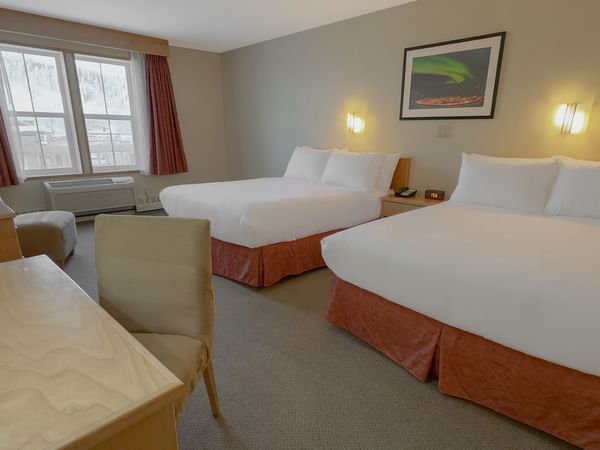 two queen beds with a work desk