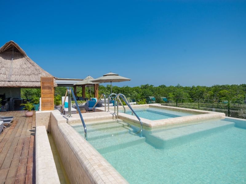 Outdoor pool area at Naay Tulum Curamoria Collection