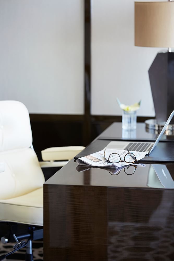 Work desk with chair & a laptop at Crown Hotel Melbourne