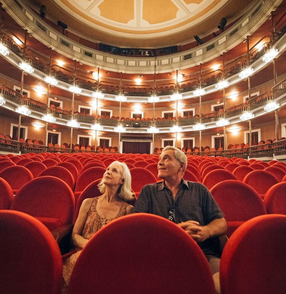 An elderly couple in Angela Peralta Theater near Viaggio Resort