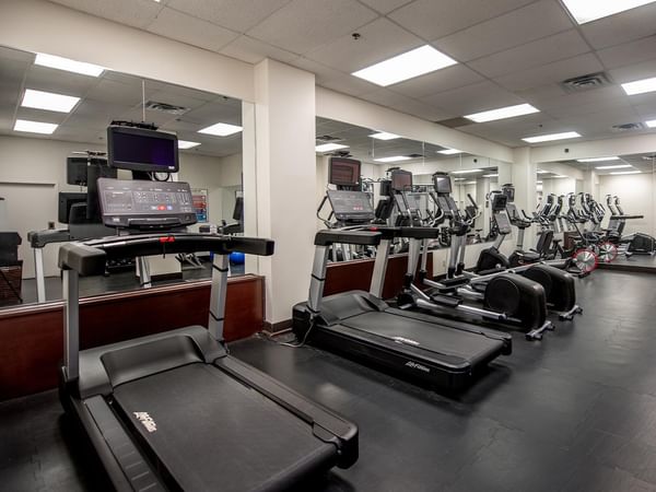Multiple treadmills and gym equipment in the hotel fitness center