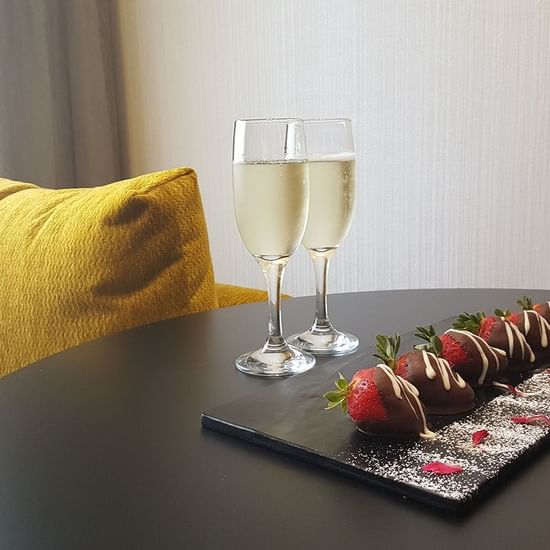 Strawberries and wine served in a room at Pullman Melbourne CBD