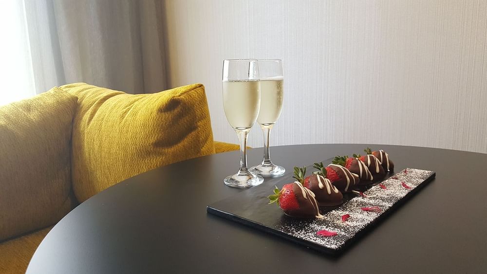 Strawberries and wine served in a room at Pullman Melbourne CBD
