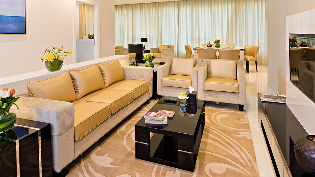 Fully equipped living room with luxury sofa set in Three Bedroom Suite at DAMAC Maison Canal Views