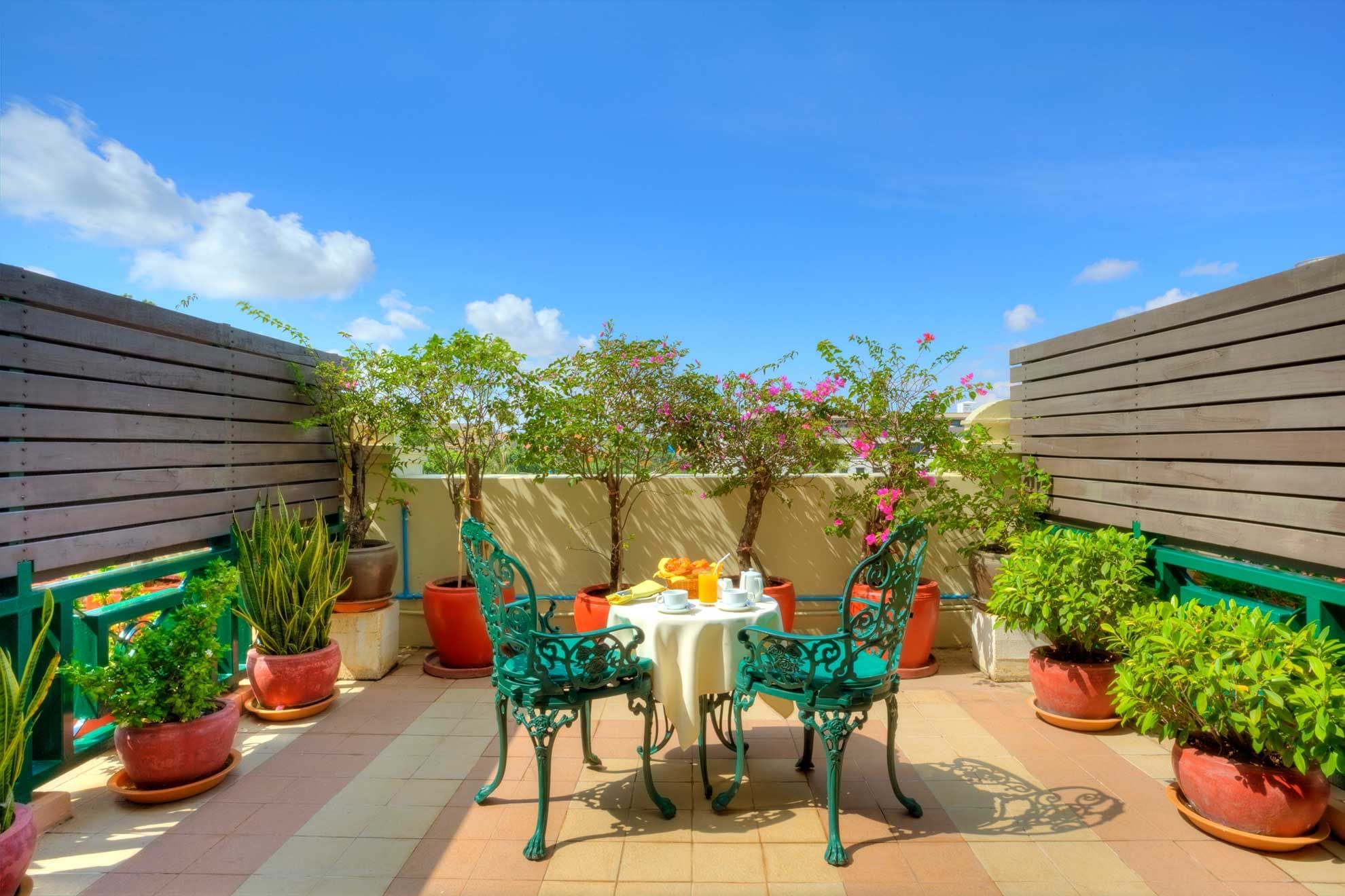 Private balcony with garden and Wat Phnom Pagoda view at Sunway Hotel Phnom Penh
