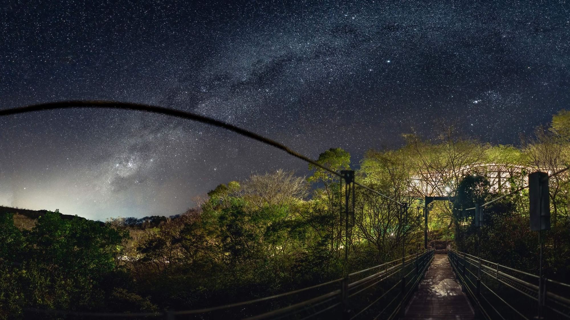 Stars shining bright in the night sky over a bridge at Hotel Rio Perdido