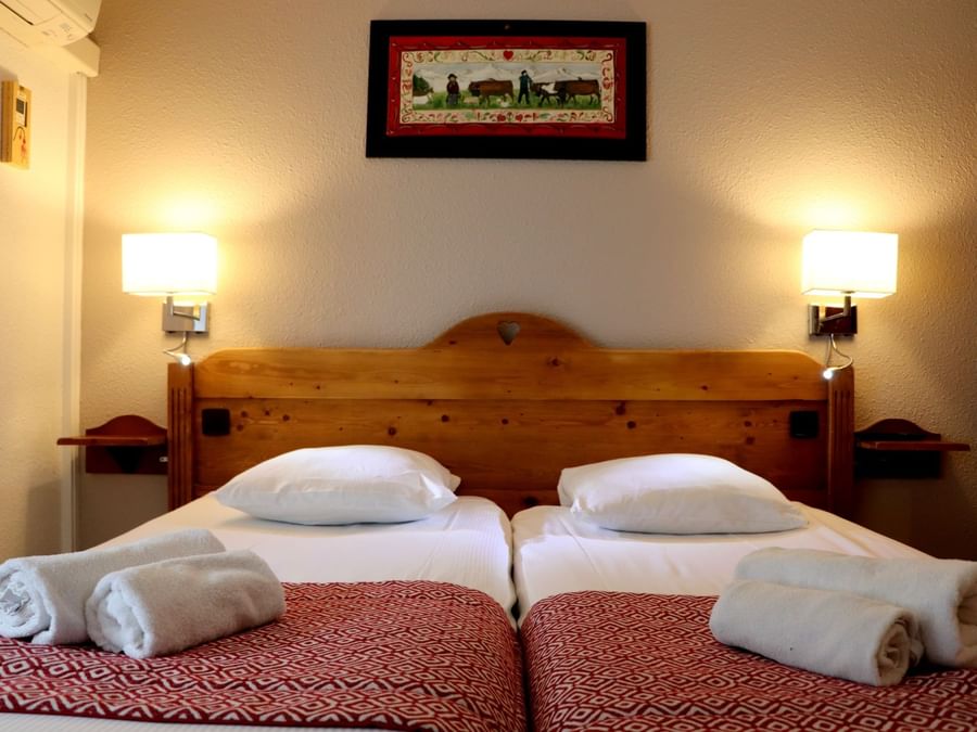 Double beds in comfort twin room at The Originals Hotels