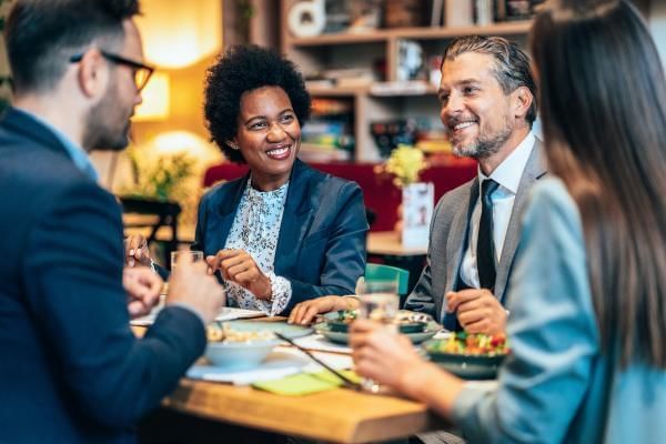 Business people having a corporate lunch and chatting away