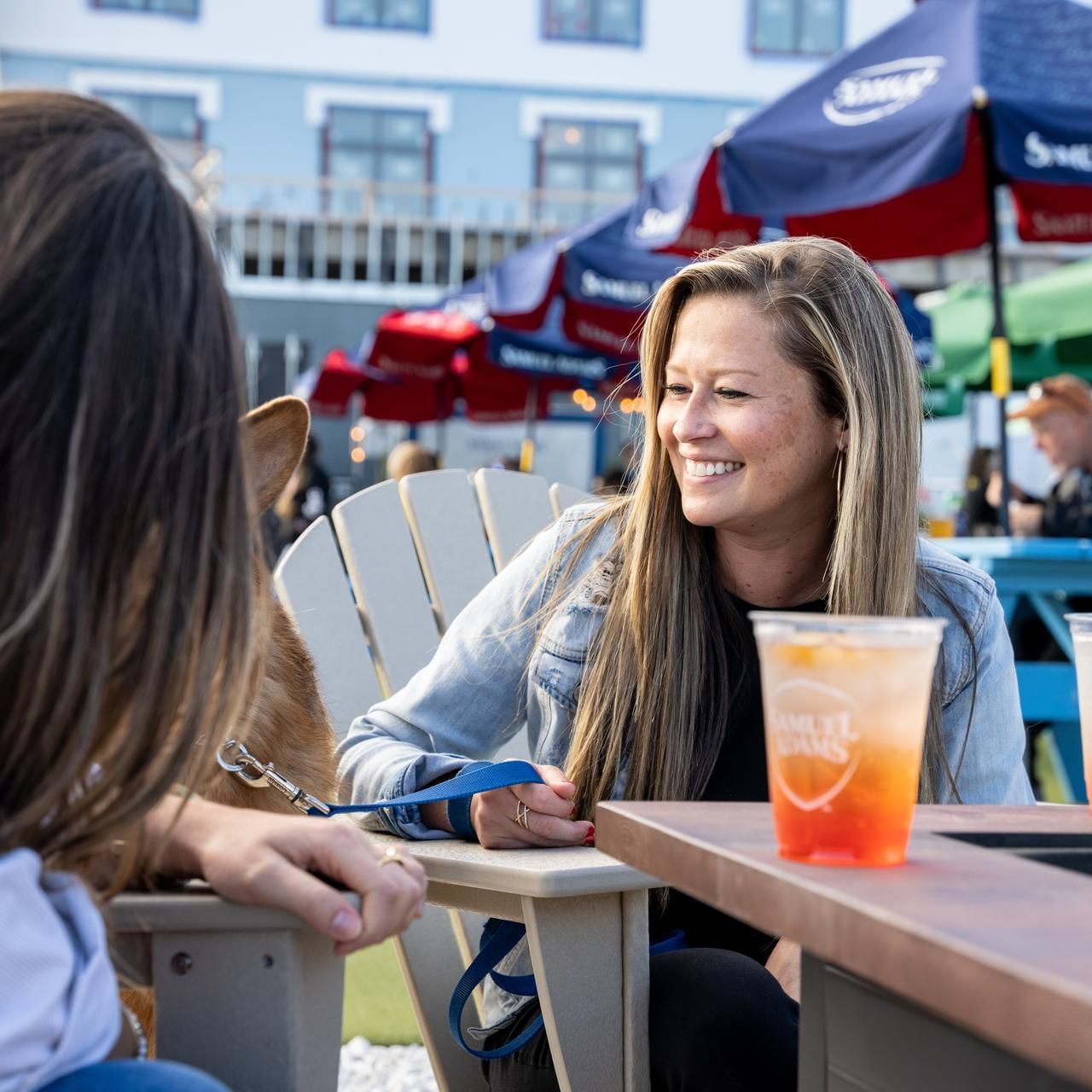 Ladies lounging while having cocktails in Beer Garden at The Artisan Hotel at Tuscan Village