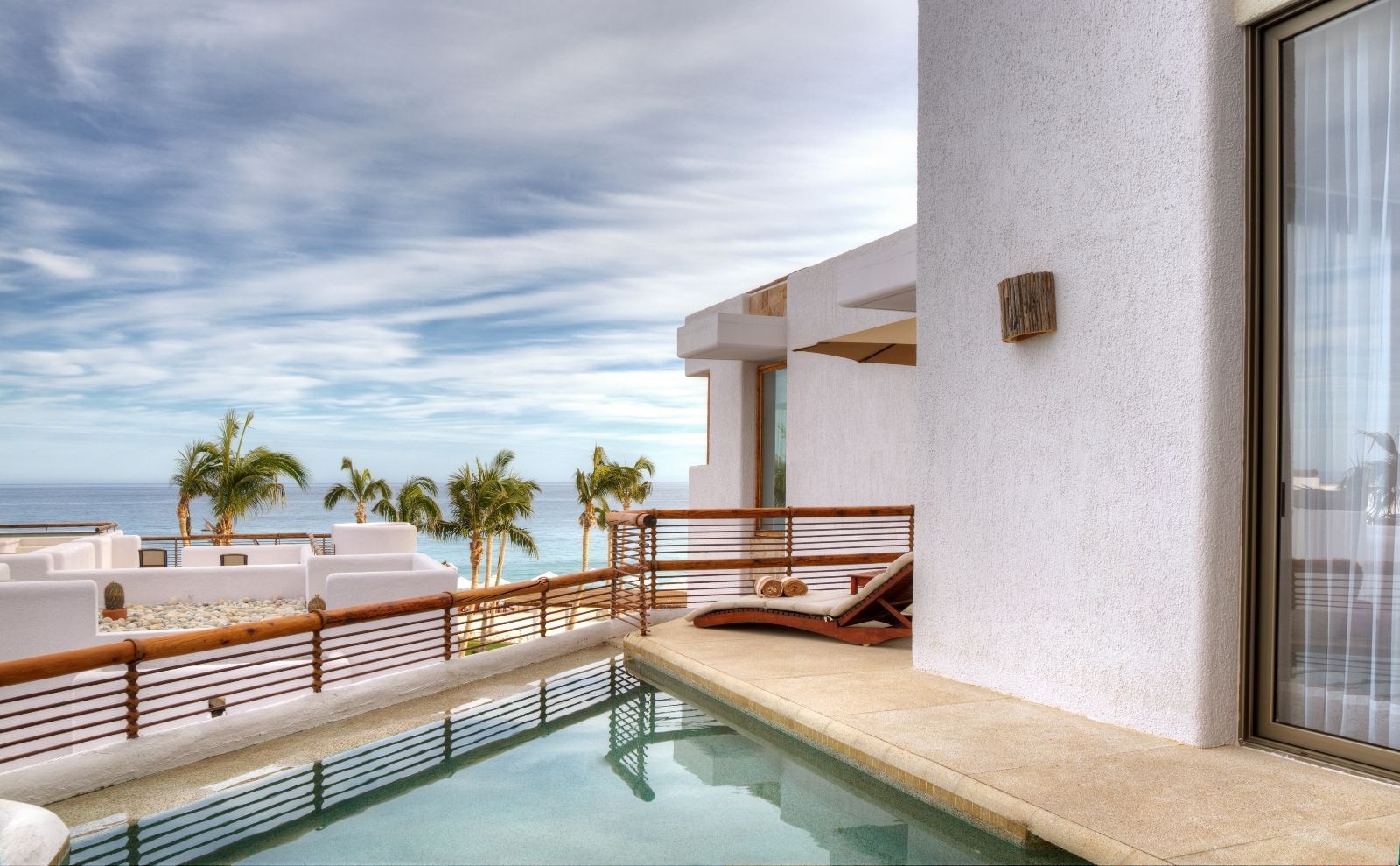 Indoor infinity pool with a deck at Marquis Los Cabos