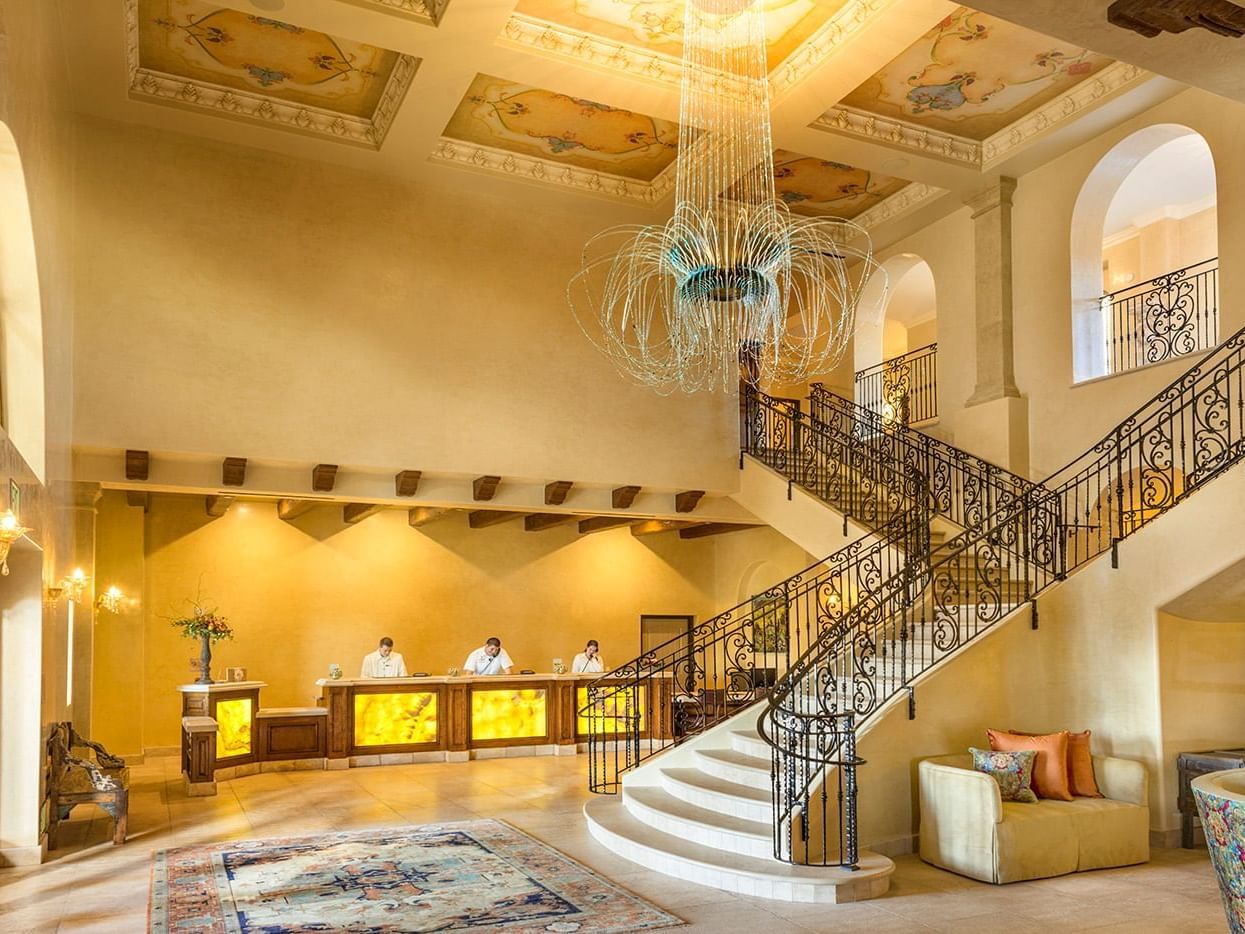Lobby with front desk and grand staircase 