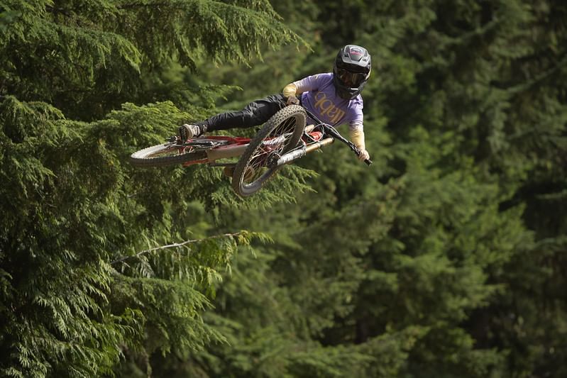 Biker through the forest near Blackcomb Springs Suites