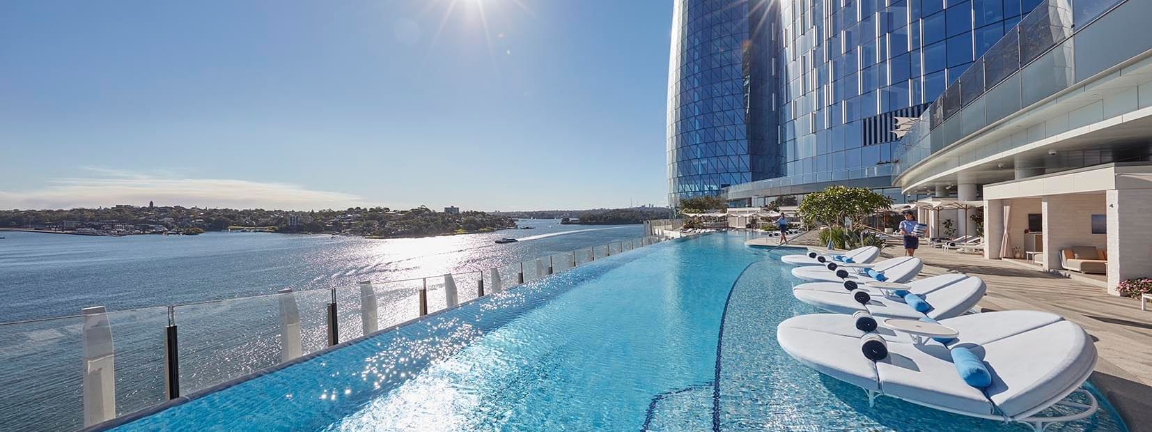 Lined pool beds by a infinity pool at Crown Hotels