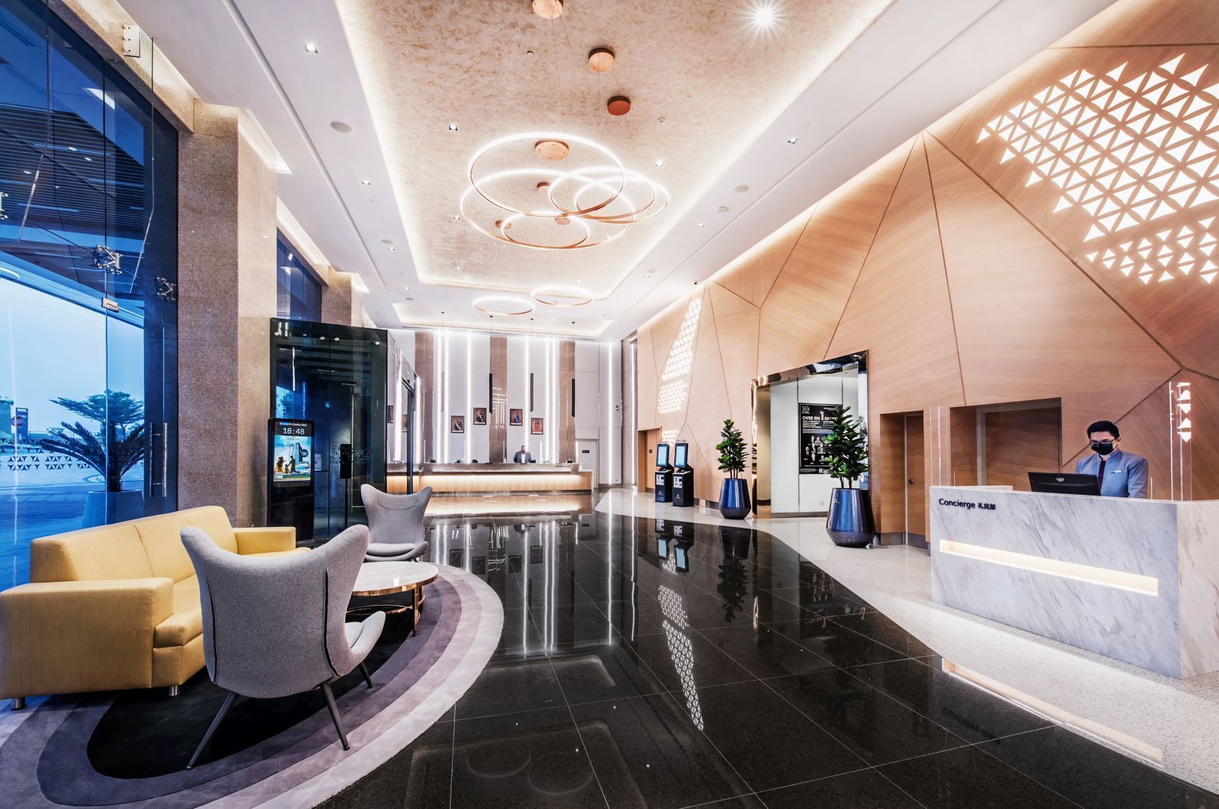 Modern lobby interior with sleek furniture and marble counter at Sunway Hotel Big Box