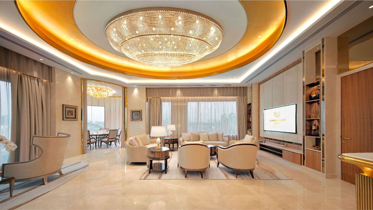 Comfy bed and pool view in a room at Sunway Hotels & Resorts