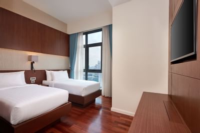 Twin Queen beds in Pinnacle Suite at Tribeca Serviced Suites