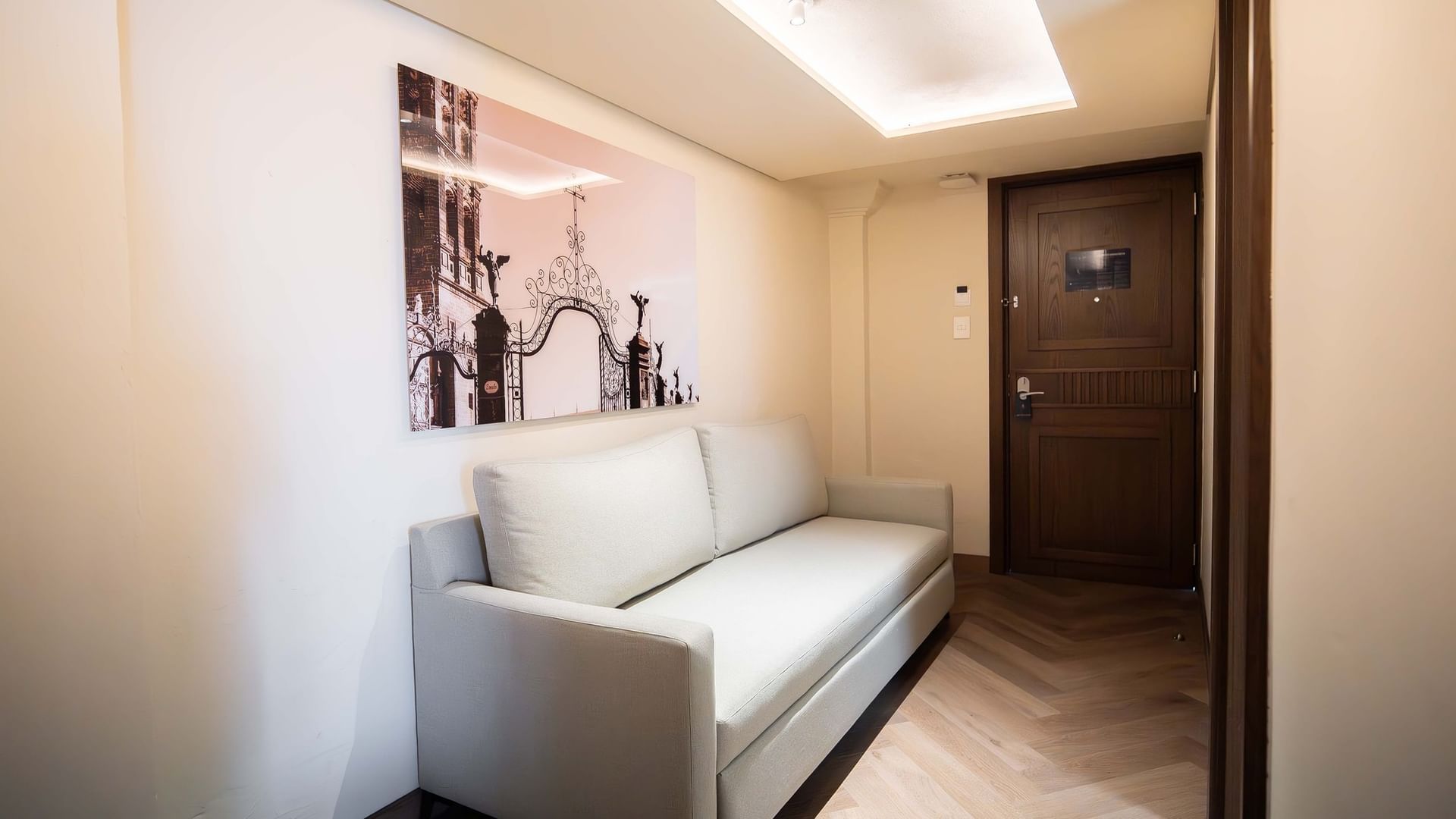 White couch in 2 King Premium room at Quinta Real Puebla in Heroica Puebla de Zaragoza.