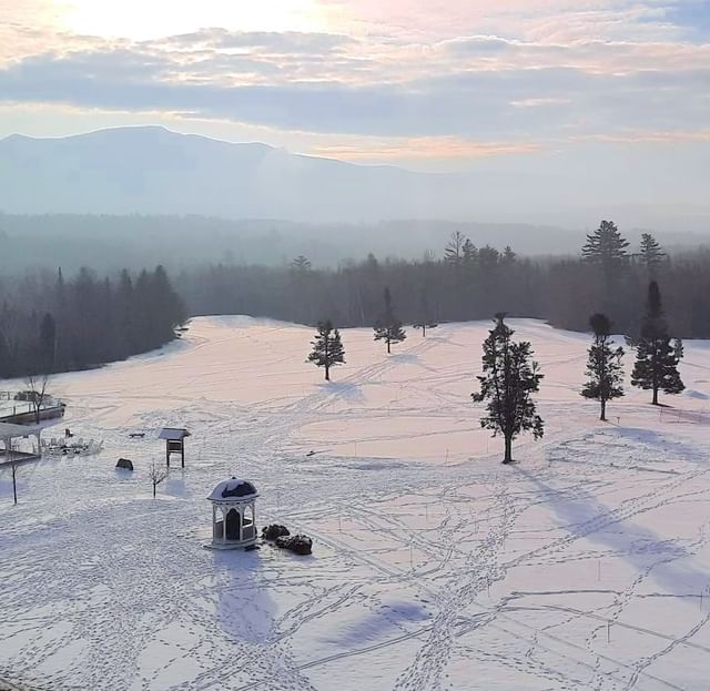 Aerial view of snow-covered landscape with trees at Mountain View Grand Resort & Spa