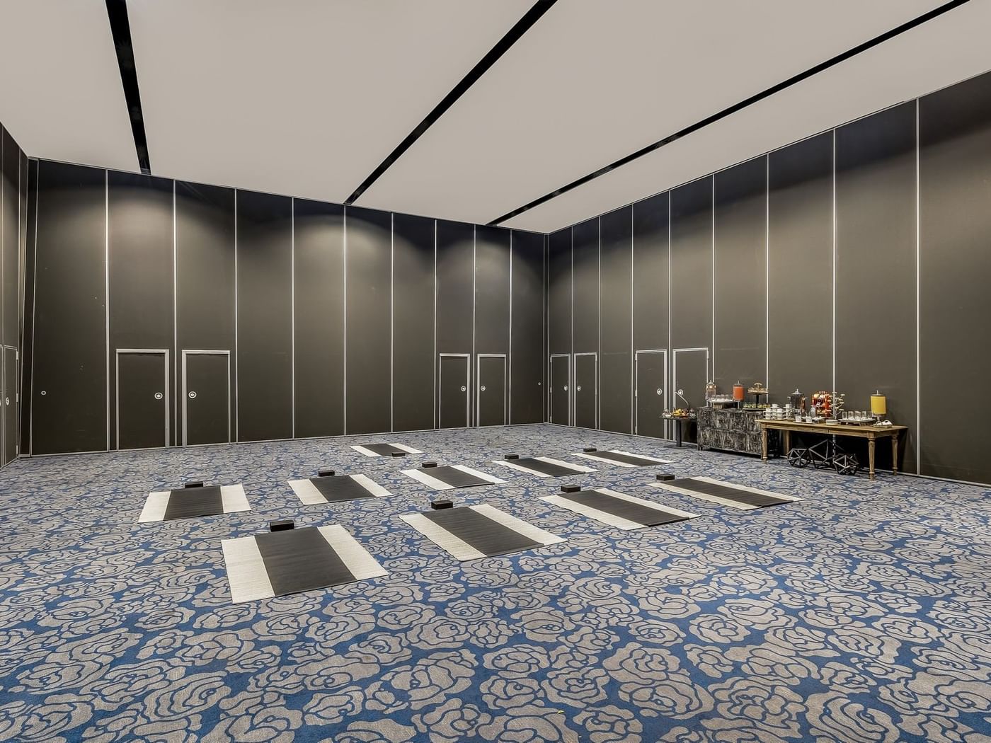 A spacious room with a carpeted floor with arranged yoga mats at Live Aqua Resorts and Residence Club
