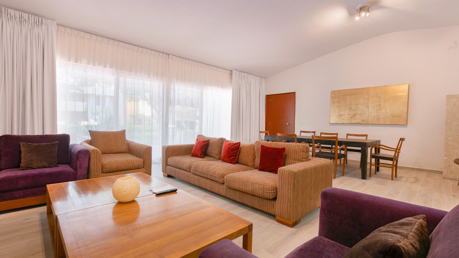 King Real Suite living area with couch, table, and dining set at Camino Real Guadalajara, Zapopan