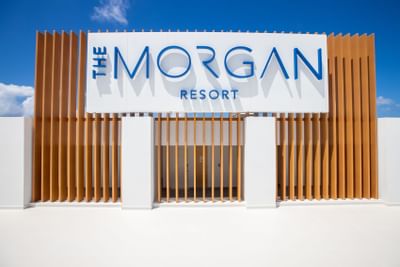 Hotel exterior with sign at The Morgan Resort Spa Village