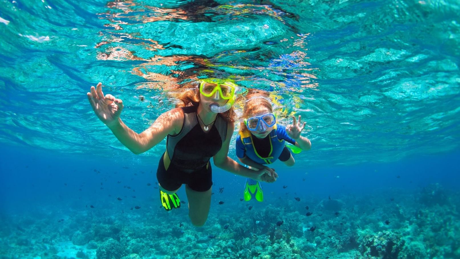 mom and daughter snorkeling at Grand Roatan Resort