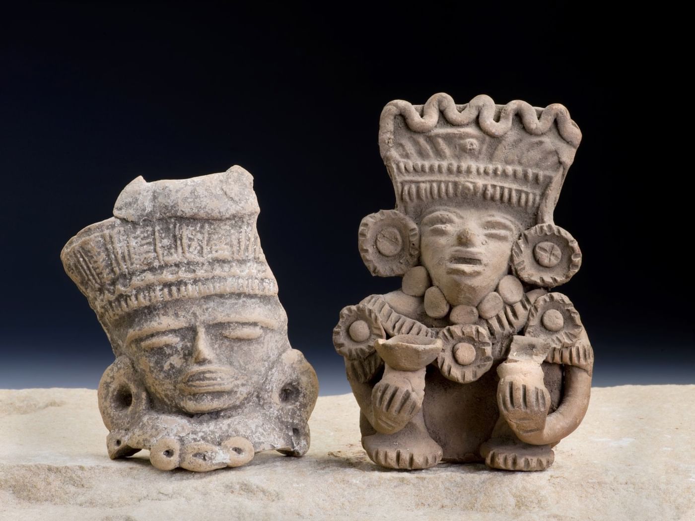 Ancient statues in Mayan culture near IOH Freestyle Hotels