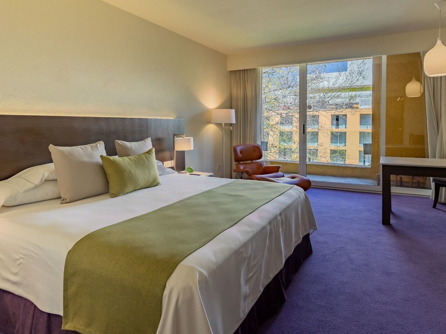 King Camino Real Club featuring a king bed, purple carpet, and a large window view at Camino Real Polanco Mexico