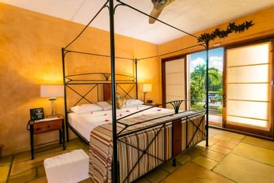 Bedroom arrangement in a Villa at True Blue Bay Hotel