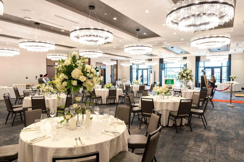 Dining tables arranged in The Ballroom at The Artisan Hotel at Tuscan Village