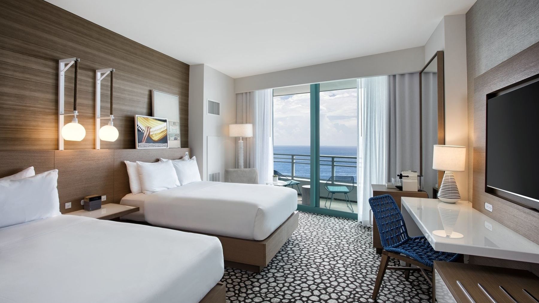 2 Double beds and working table in Deluxe Double Oceanfront room at The Diplomat Resort