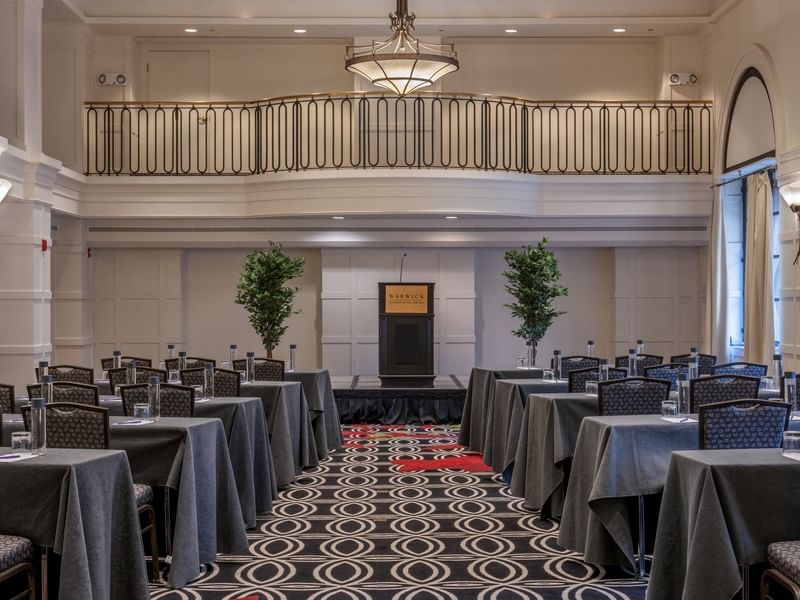 Classroom setup facing the podium in Buckingham Ballroom at Warwick Allerton Chicago