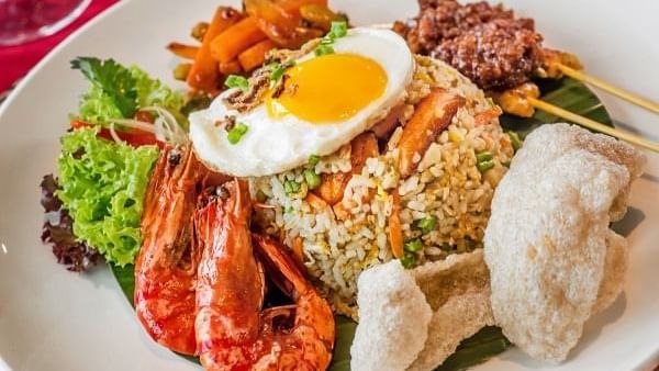 Indonesian nasi goreng with prawns & a fried egg served on a plate in Pendas Cafe at Sunway Hotel Big Box