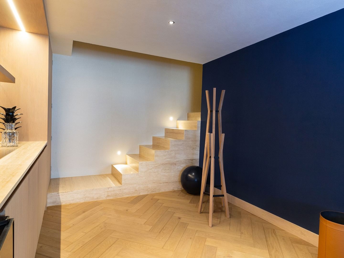 King Superior Viceroys Suite interior stairs with a navy blue accent wall and wood floors at Camino Real Polanco Mexico