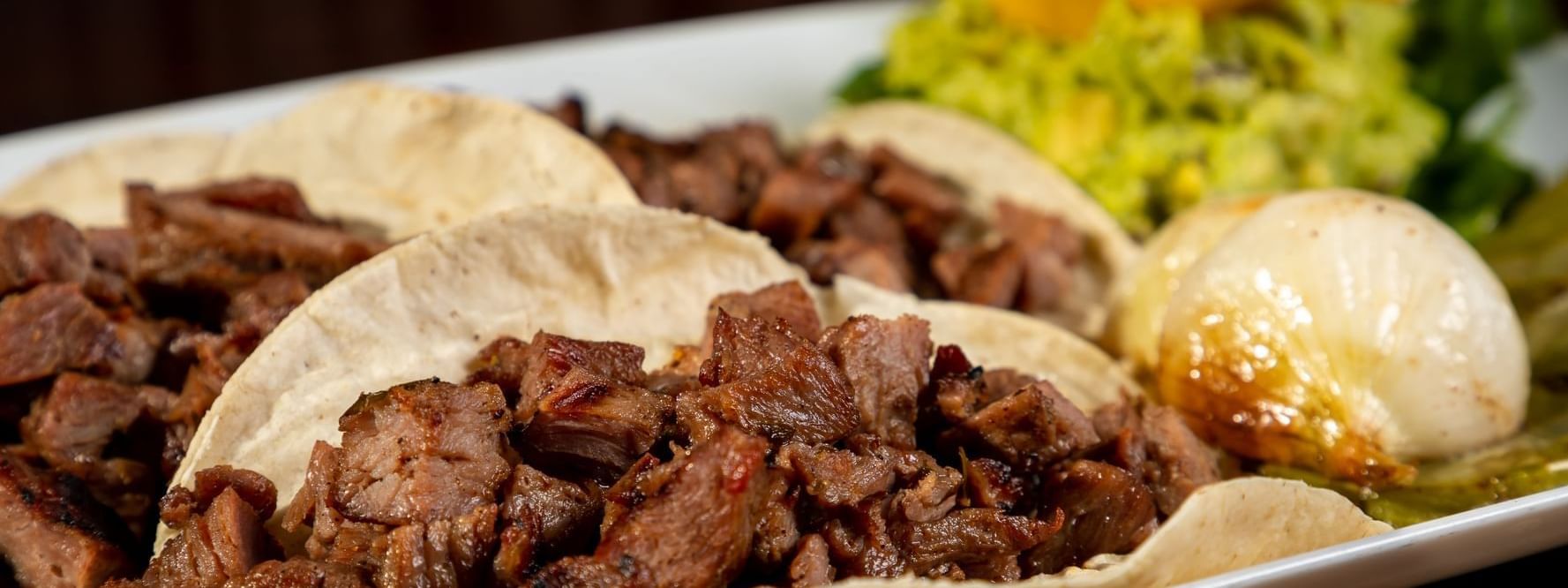 Delicious plate of meat tacos with guacamole, an authentic dish at the Marquis Los Cabos Resort