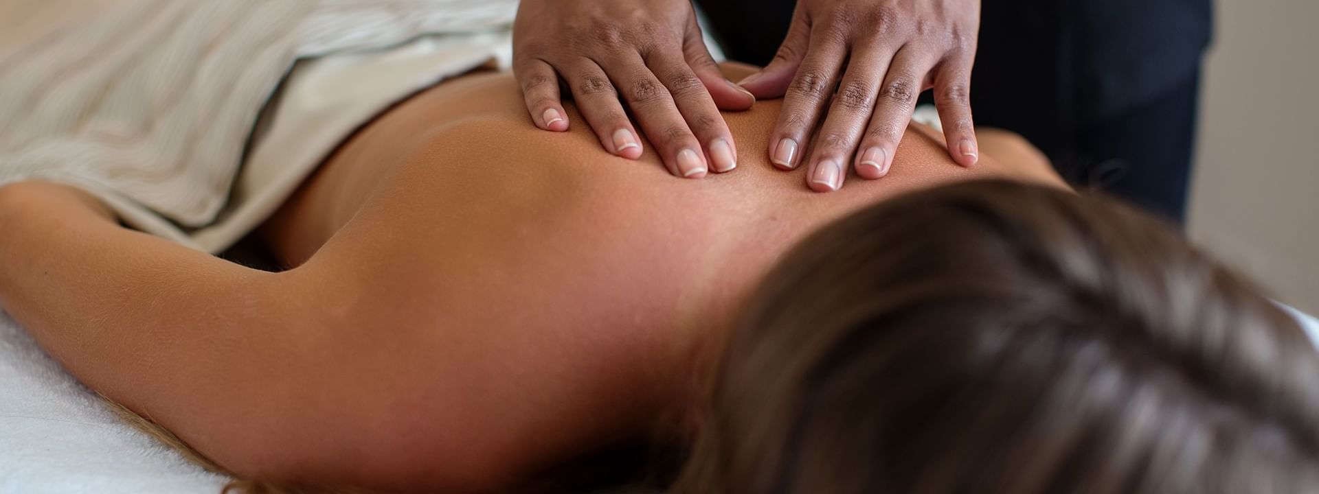 A lady receiving a massage in Amber Spa at Warwick Paradise Island Bahamas