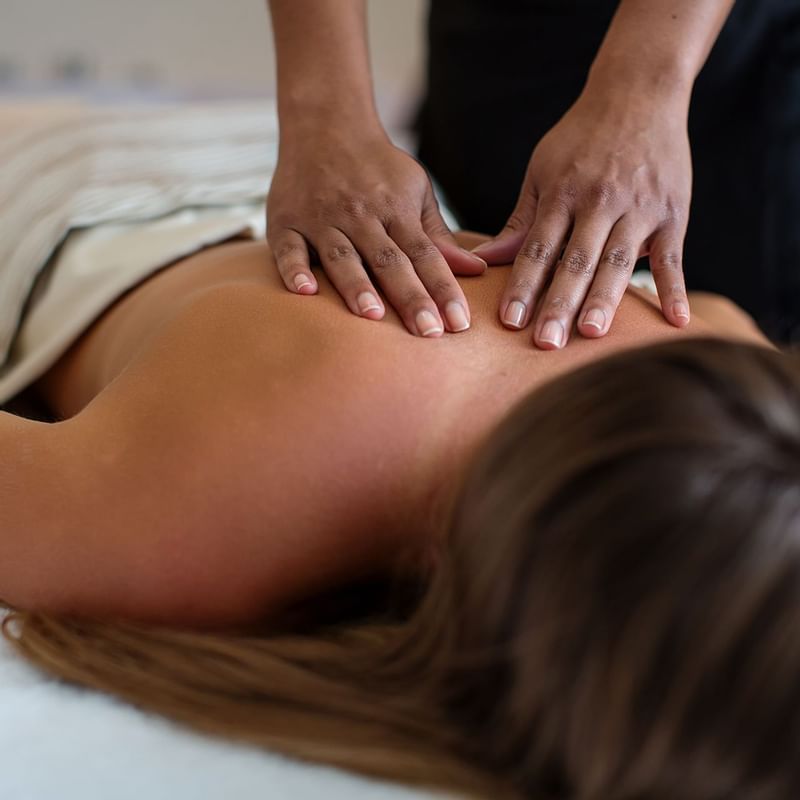 A lady receiving a massage in Amber Spa at Warwick Paradise Island Bahamas