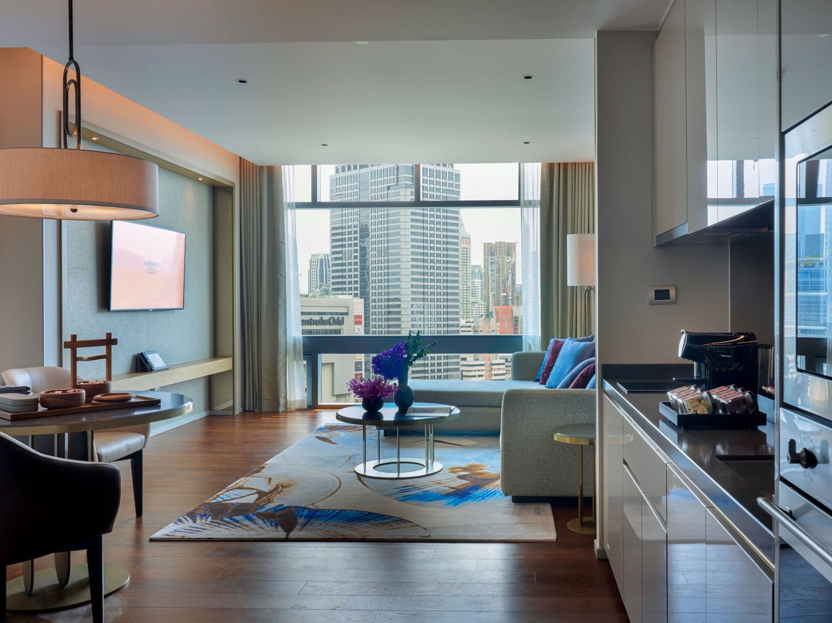 Kitchen & lounge, One Bedroom Suite at Chatrium Grand Bangkok