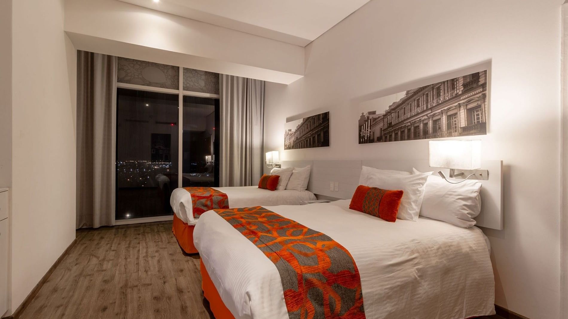 2 Double Suite 1 Room featuring white linens and orange patterned bed runners at Camino Real Puebla Angelopolis