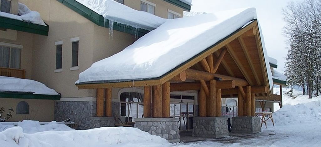 snowy front entrance of Coast Hillcrest Hotel in Revelstoke BC