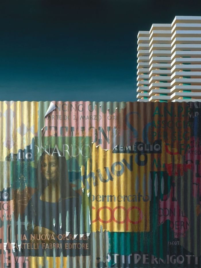 Colorful metal sheet wall with a building in the background at Soirée.