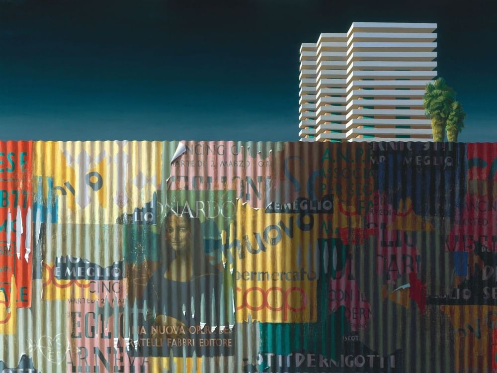 Colorful metal sheet wall with a building in the background at Soirée.