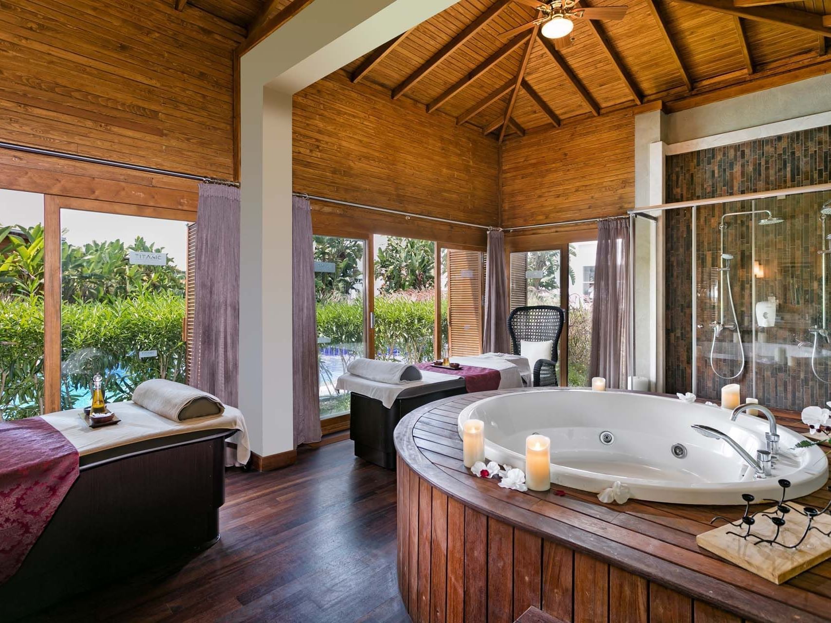 Massage beds, jacuzzi, and tropical view in Spa Suite at Titanic Deluxe Golf Belek