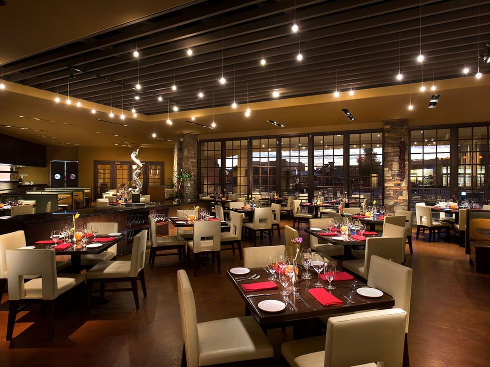 Red Sage Restaurant Bar at the Hilton Santa Fe Buffalo Thunder hotel in New Mexico.e plates and red napkins.